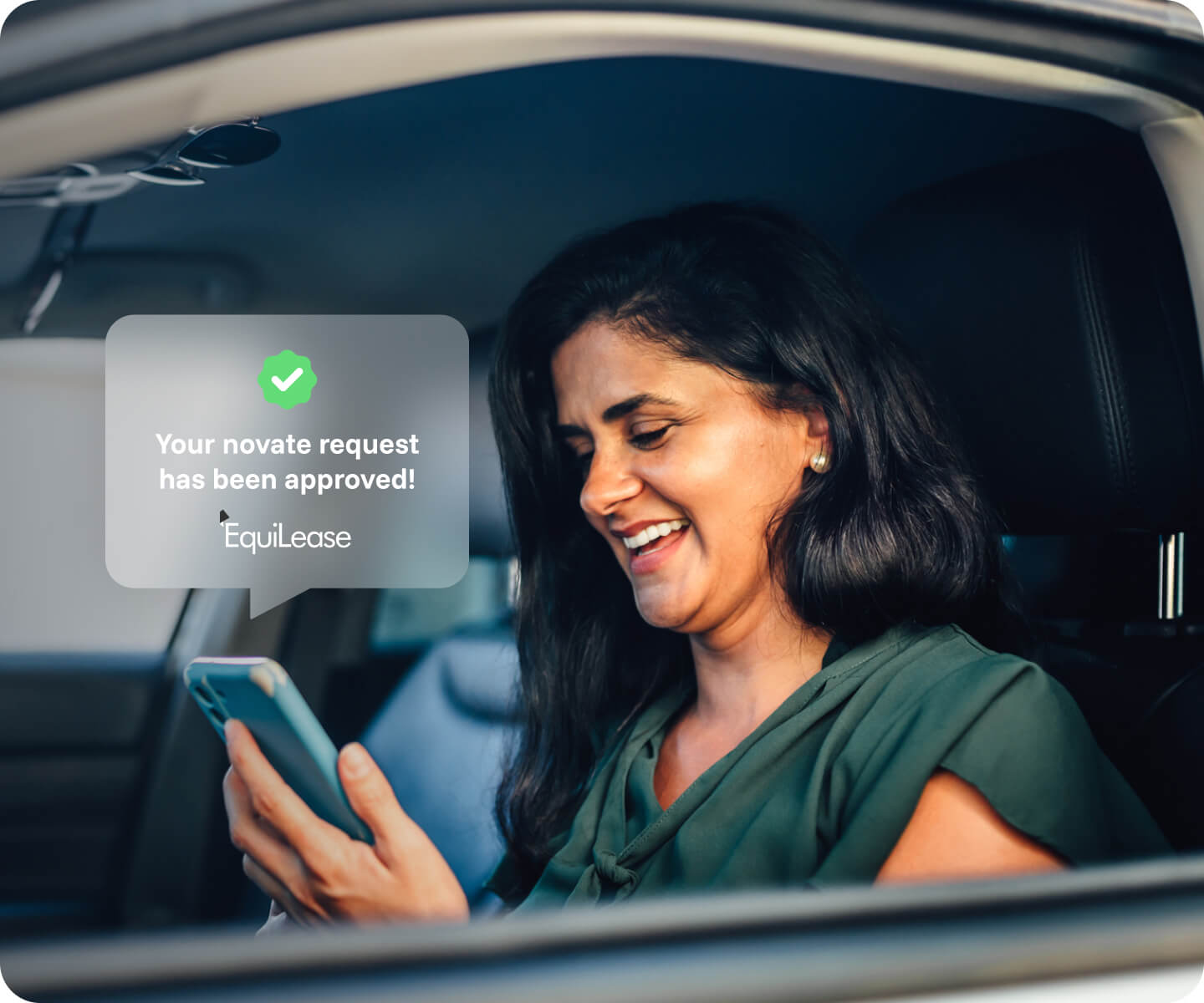 Woman smiling looking at her phone with an EquiLease approval notication appearing
